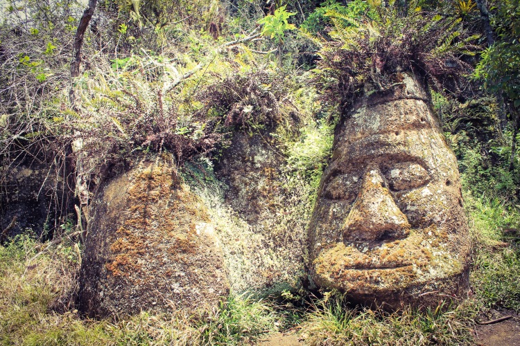 Weird stone heads with pineapple hair.